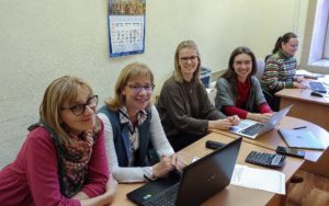 People working together in front of their laptops.