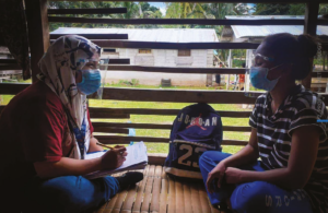 A UNHCR field officer interviews an IDP